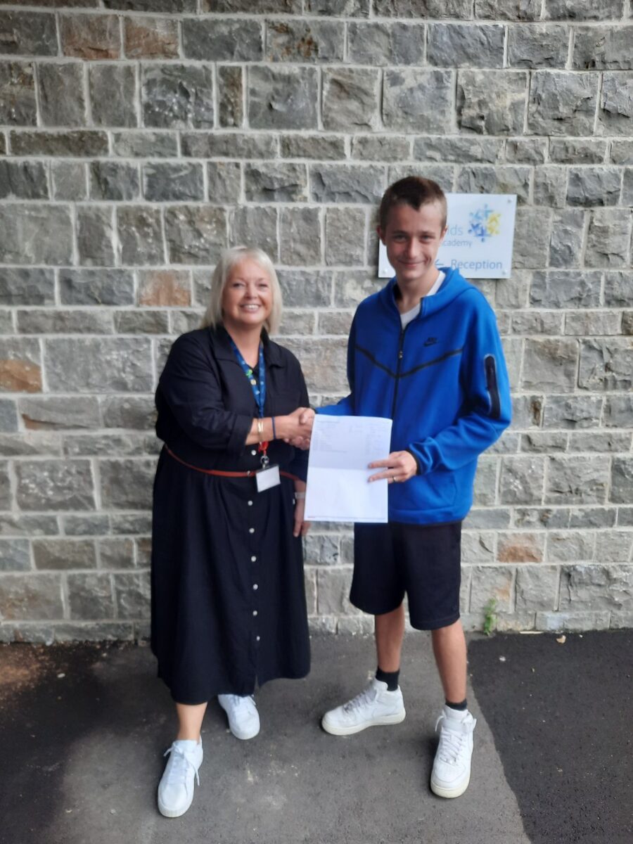 Student holding their results with Dee Pickerill, Principal of Leigh Academy Snowfields.