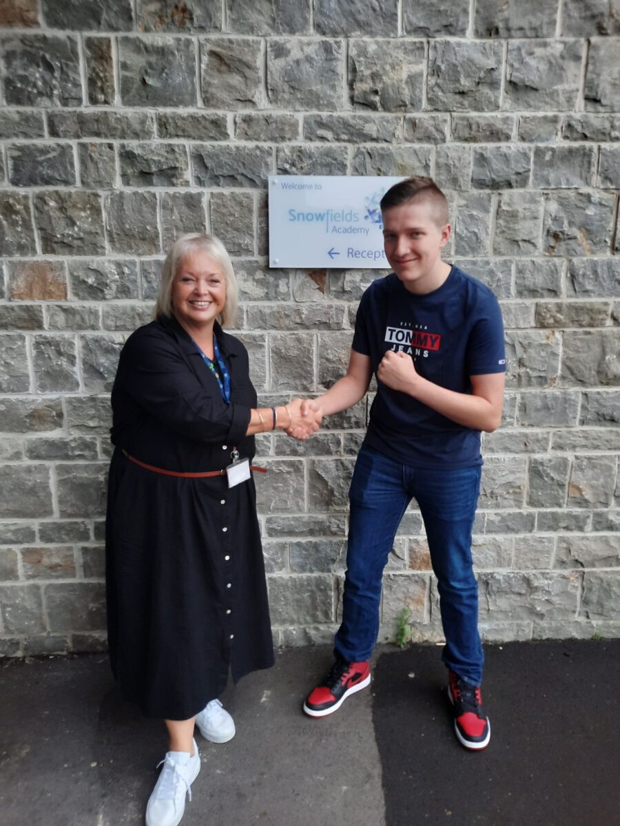 Student holding their results with Dee Pickerill, Principal of Leigh Academy Snowfields.