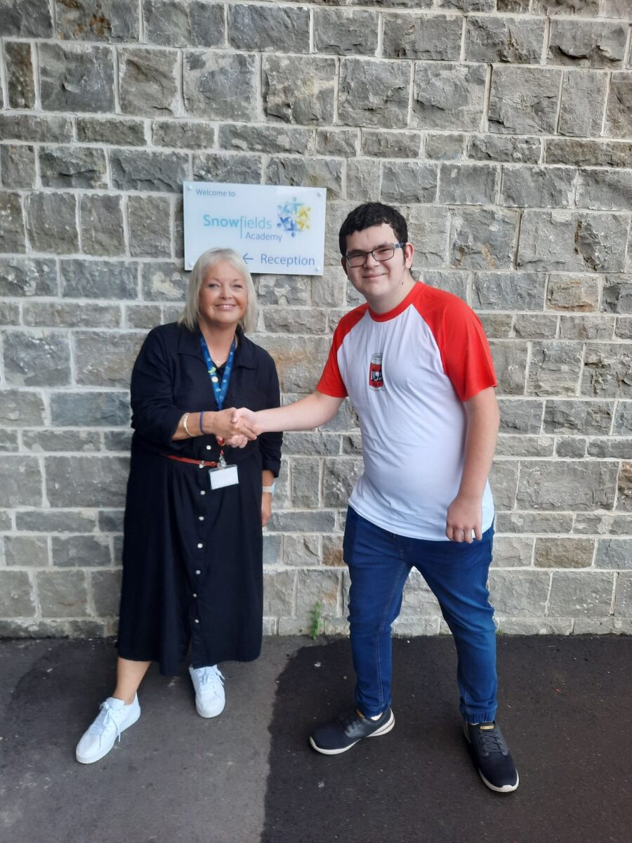 Student holding their results with Dee Pickerill, Principal of Leigh Academy Snowfields.